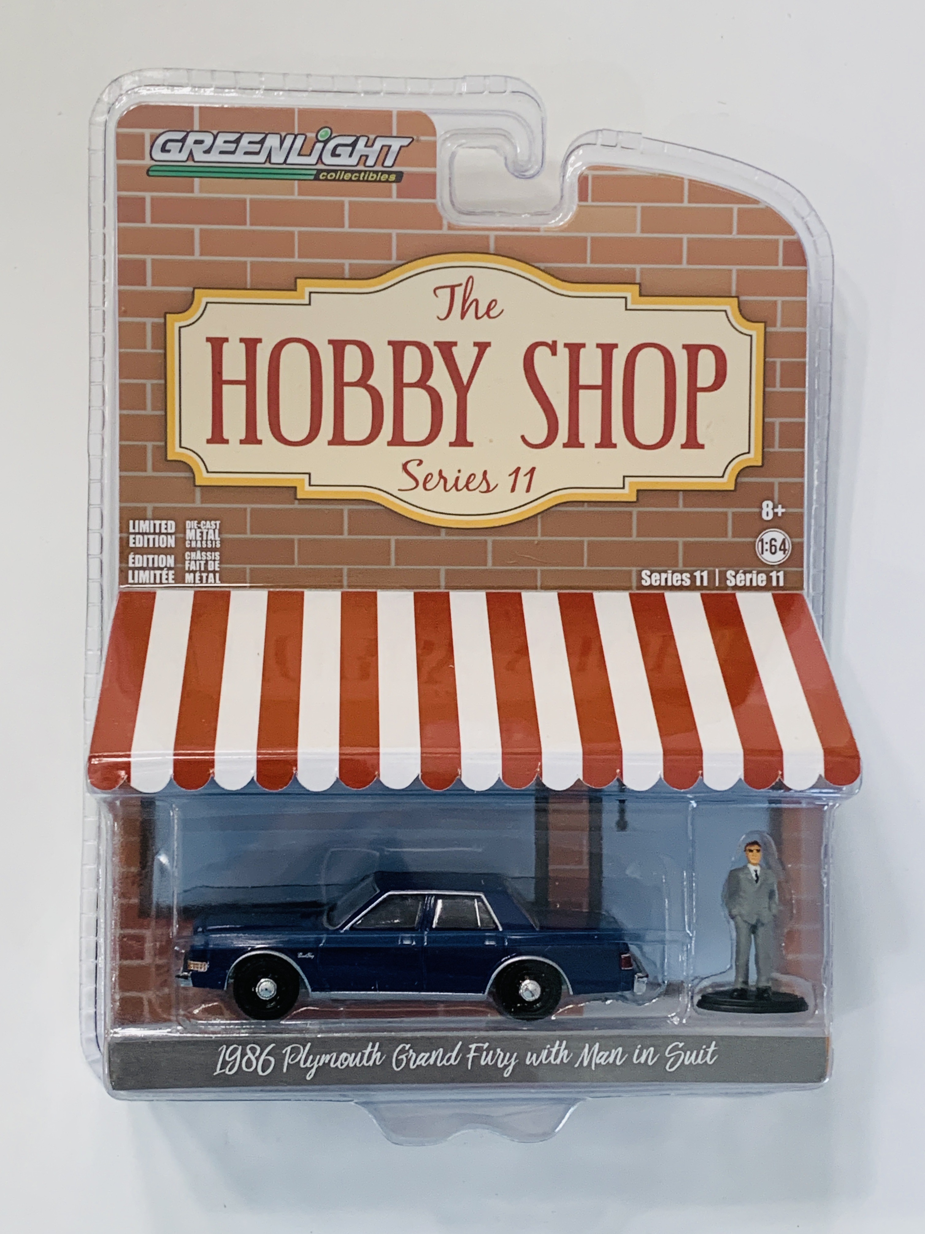 Greenlight The Hobby Shop Series 11 1986 Plymouth Grand Fury with Man In Suit